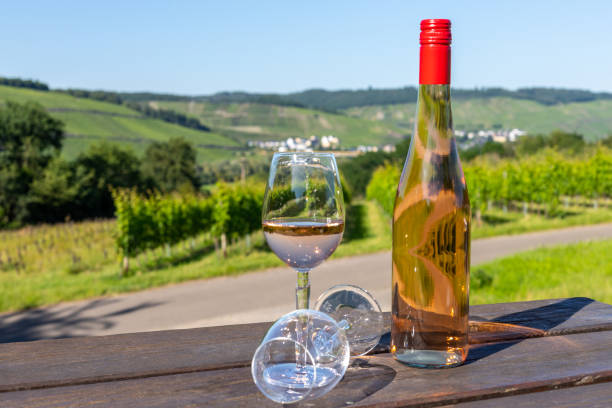istock Wine bottle with glasses on wooden table 1258004831