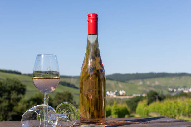 istock Wine bottle with glasses on wooden table 1258004837