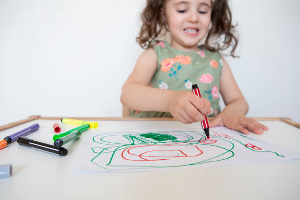 istock Little girl drawing with pencil 1258005553