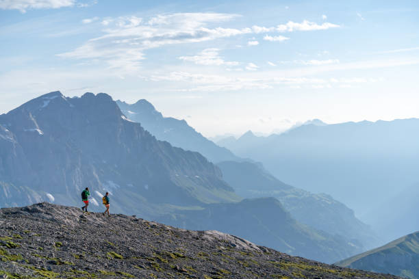 istock Female hikers walk along mountain ridge 1258006852