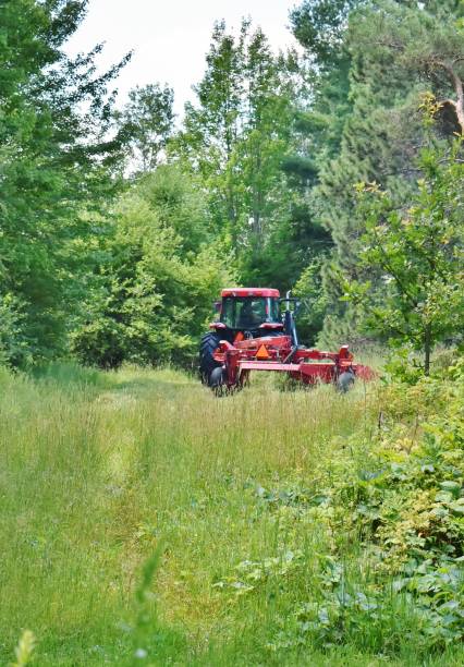 istock Farm Machinery at work in a Field 1258007842