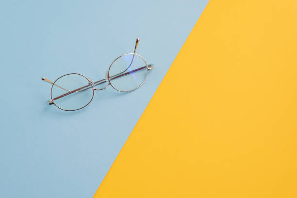 Eyeglasses desk mustard yellow and celeste blue stock photo