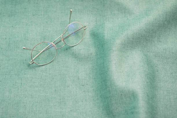 istock Eyeglasses desk aqua menthe fabric light green 1258008268