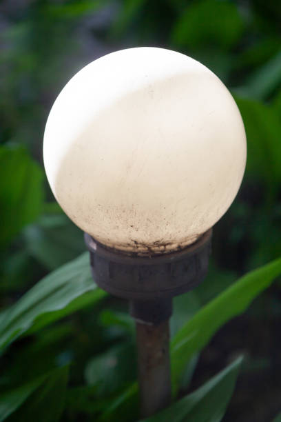 istock Round lamp in form of  ball on dark background 1258009198
