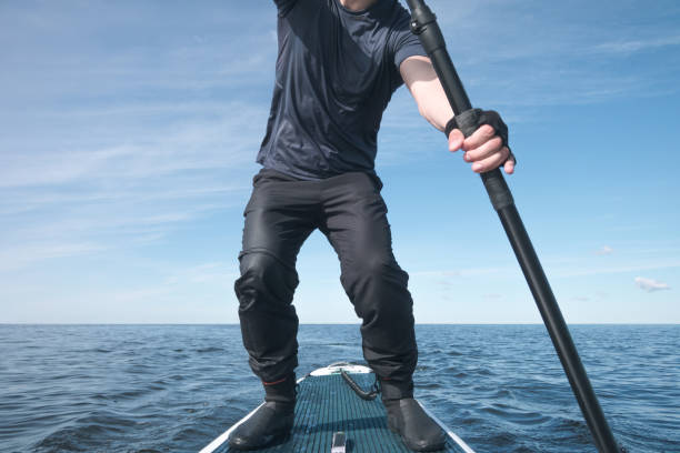 istock Surfer on a paddle board on the high seas 1258009455