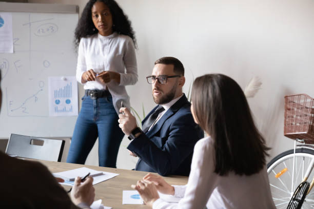 istock Diverse colleagues brainstorm discussing ideas at meeting 1258009520