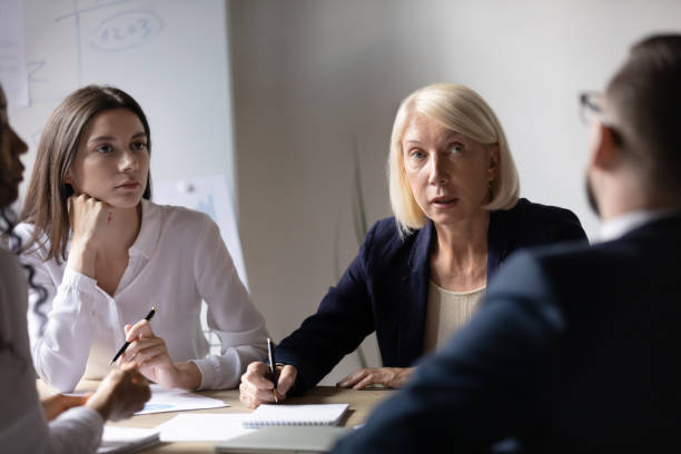 istock Diverse colleagues cooperating at business meeting in office 1258010091