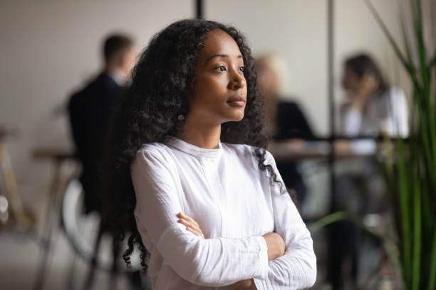 istock Pensive biracial woman look in distance thinking over problem solution 1258010094