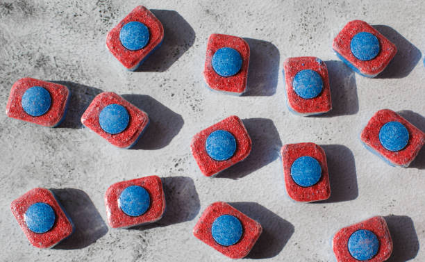 istock Red and blue tablets for dishwashing machine. Detergents for home hygiene 1258010677