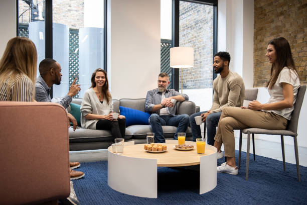 istock Group of business people in office cafeteria 1258011363