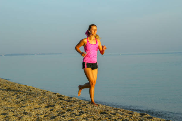 istock Jogging by the sea 1258013906