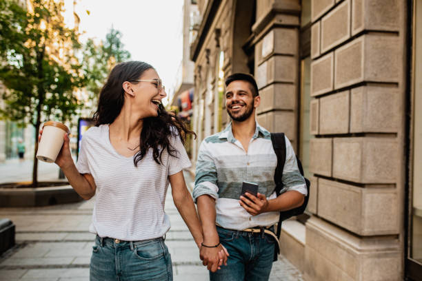 istock Couple walking in the city and having fun 1258016310
