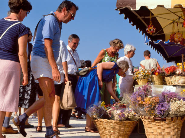 Coustelet,France-September 15,2019: Shoppers at the weekly flower Market in Costelet, Luberon, Provence, France, Europe