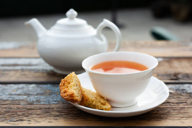 Tea and almond biscuit outdoors stock photo