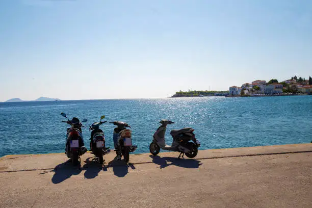 Photo of ranquil scene on Greek islands -idyllic  photo on island Spetses (ecological)  - mopeds .