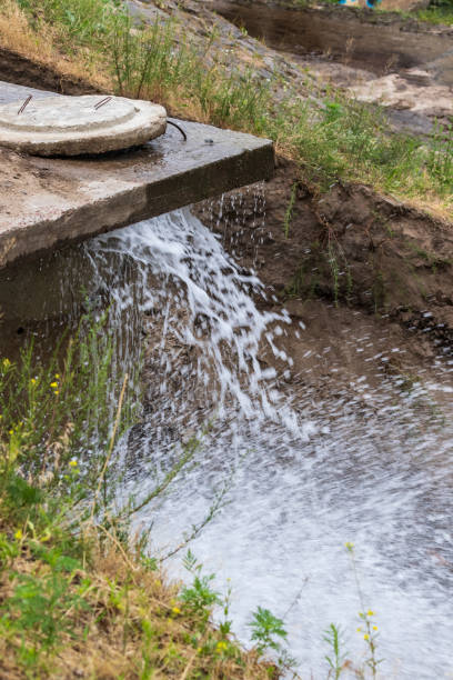 istock Accident sewerage system. Water supply failure. Breakthrough of the water supply system. A fountain of water flows out of the sewer under high pressure. 1258025036