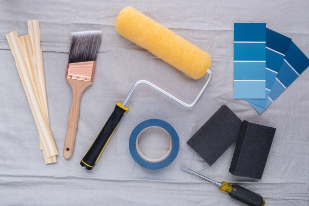 кисть, ролик краски и другие сопутствующие инструменты - screwdriver isolated blue work tool стоковые фото и изображения