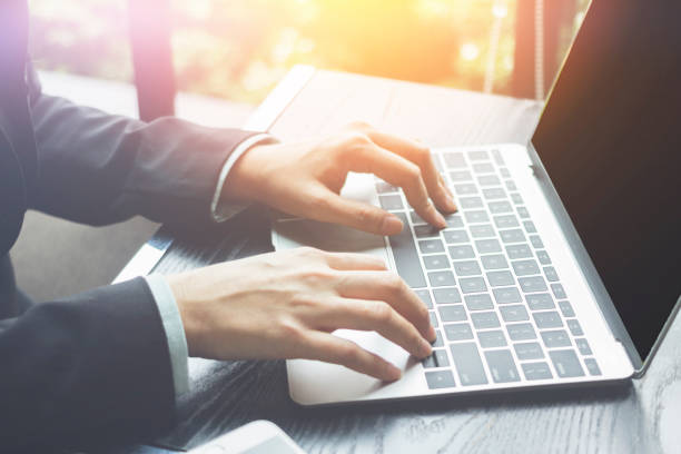 istock Business professional working remotely and laptop computer.  Finance and progress. 1258027951