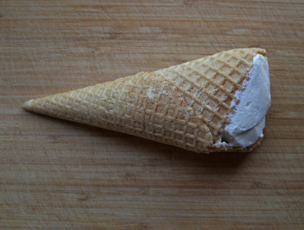 istock Big ice cream cone on the table. 1258027999