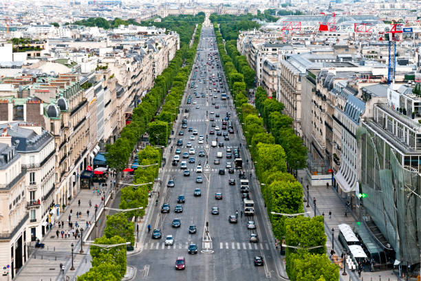 Aerial view of Paris cityscape with Avenue des Champs-Elysees from the top of Triumphal Arch (Place de l'Etoile / place Charles de Gaulle ). Paris in France. June 15, 2020.
