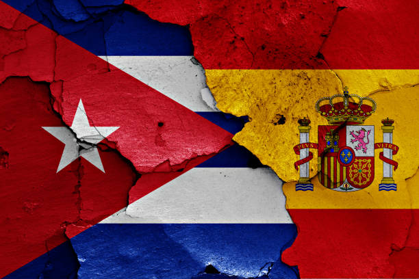 istock flags of Cuba and Spain painted on cracked wall 1258031732