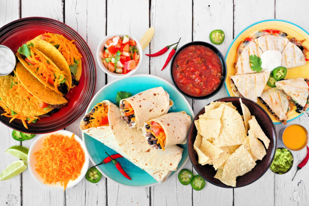 istock Mexican food table scene, top view over a white wood background 1258034916