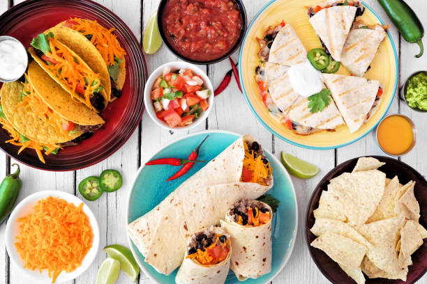istock Mexican food table scene, overhead view on a white wood background 1258034998