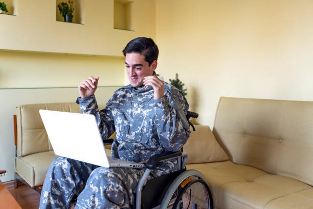 istock Soldier is Having a Video Call over his Laptop 1258035707