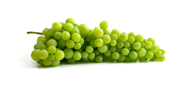 Fresh green grapes with leaves. Isolated on white background