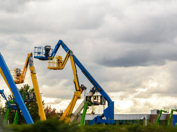 istock Multicolored mobile telescopic lifts against the sky. 1258044176