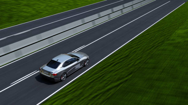 istock car driving on a road 1258044289