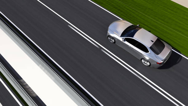istock car driving on a road 1258044290