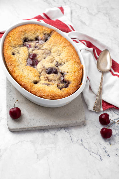 istock Homemade Cherry Cobbler on White Marble Counter 1258046777