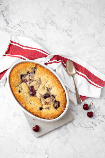 istock Homemade Cherry Cobbler on White Marble Counter 1258046778