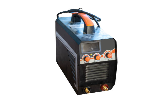 istock Welder with protective mask welding steel structures and bright sparks in construction industry. 1258049742