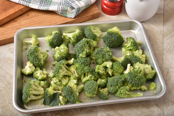 istock Broccoli florets in a baking pan to be roasted 1258050304