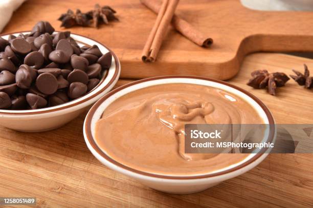 Bowls Of Creamy Peanut Butter With Dark Chocolate Chips Stock Photo - Download Image Now