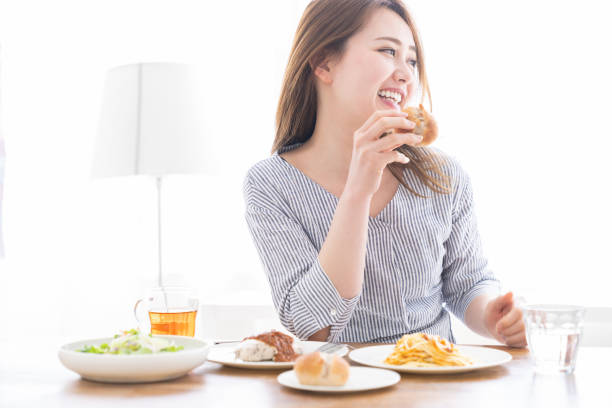 istock asian woman who eats 1258052824