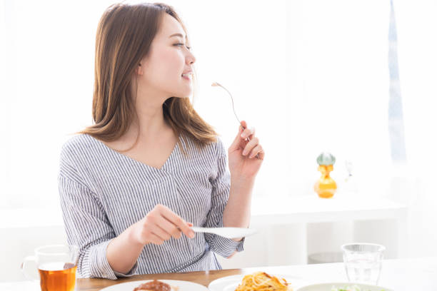 istock asian woman who eats 1258052838