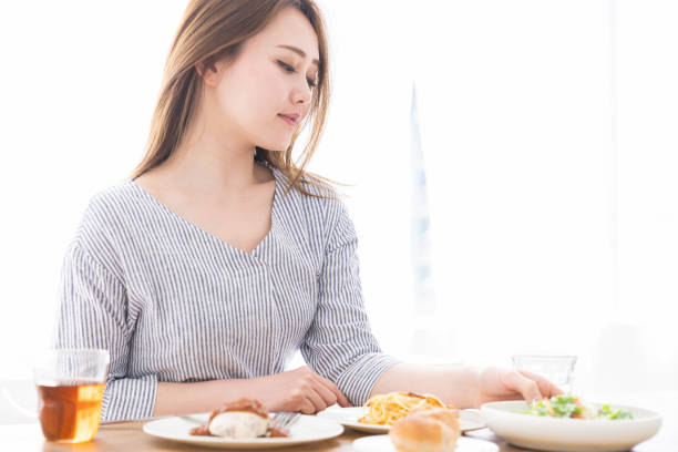 istock asian woman who eats 1258052884