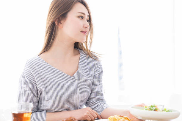 istock asian woman who eats 1258052908