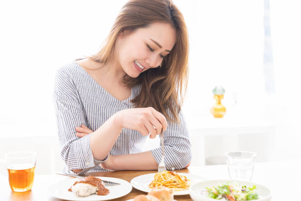 istock asian woman who eats 1258052915
