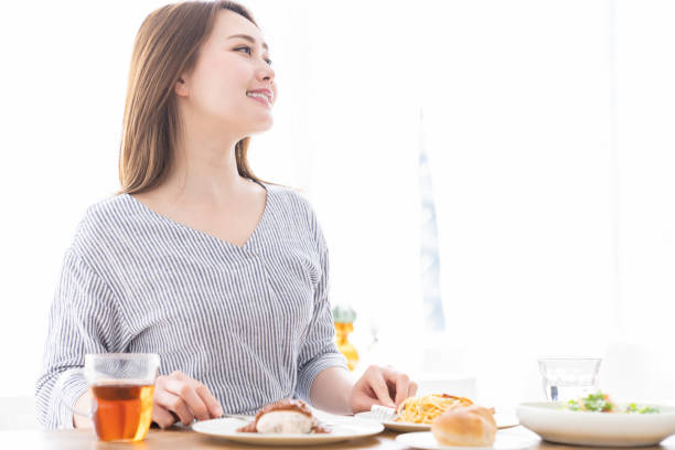 istock asian woman who eats 1258052923