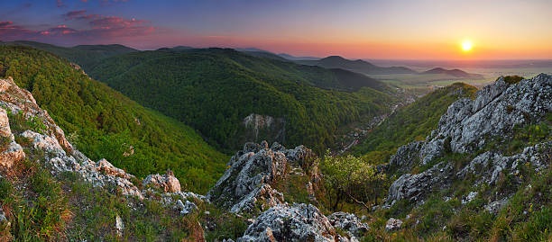 istock Green Rocky moutain at sunset wih sun. 125806220