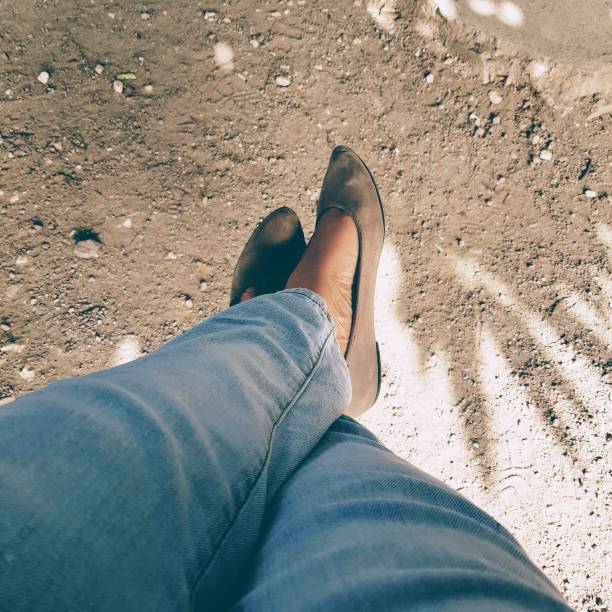 Crossed legs swinging above ground