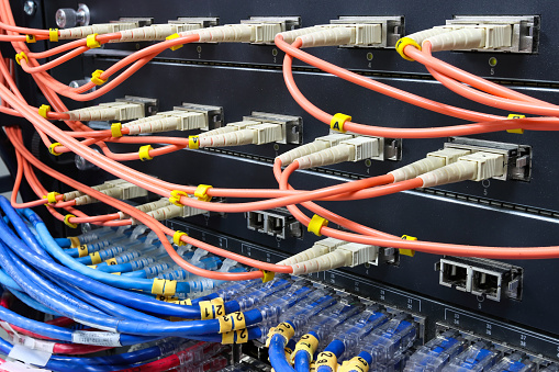 cable network, fiber optic cable connect to switch port in server room ,Concept network management