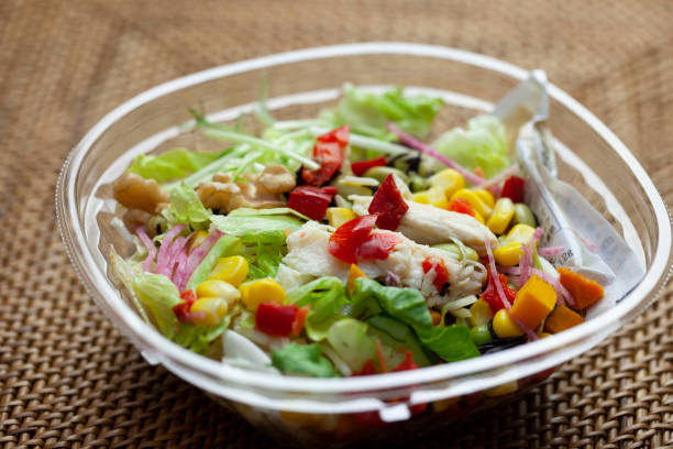 istock Close up of vegetable salad with chicken on top 1258072012