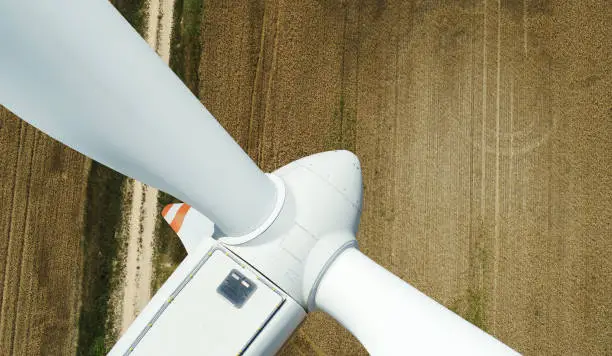 Photo of Wind turbine in operation. Close-up aerial view.