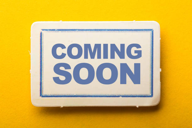 istock Coming Soon Label On Yellow Background 1258078328