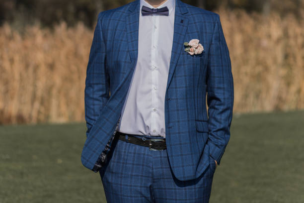 istock groom in suit in the field 1258080072